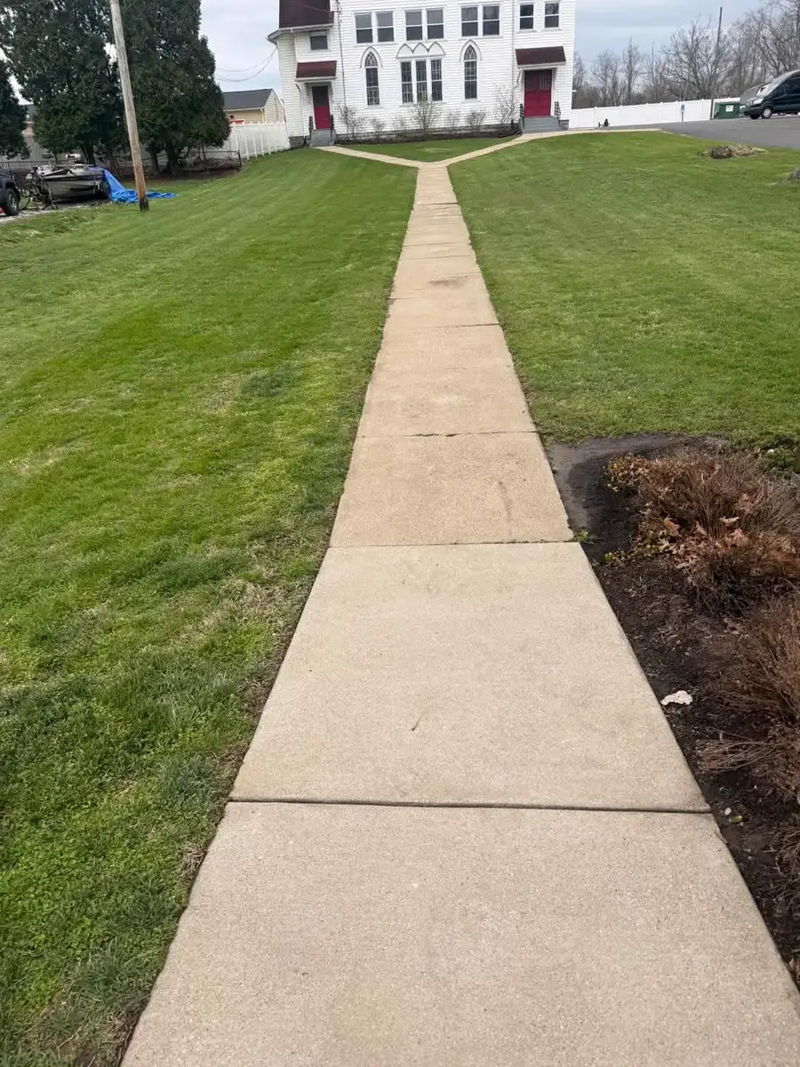Walkway after pressure washing — clean concrete