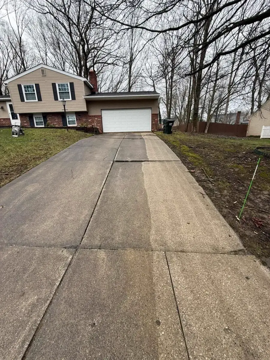 Surface before pressure washing — grime buildup